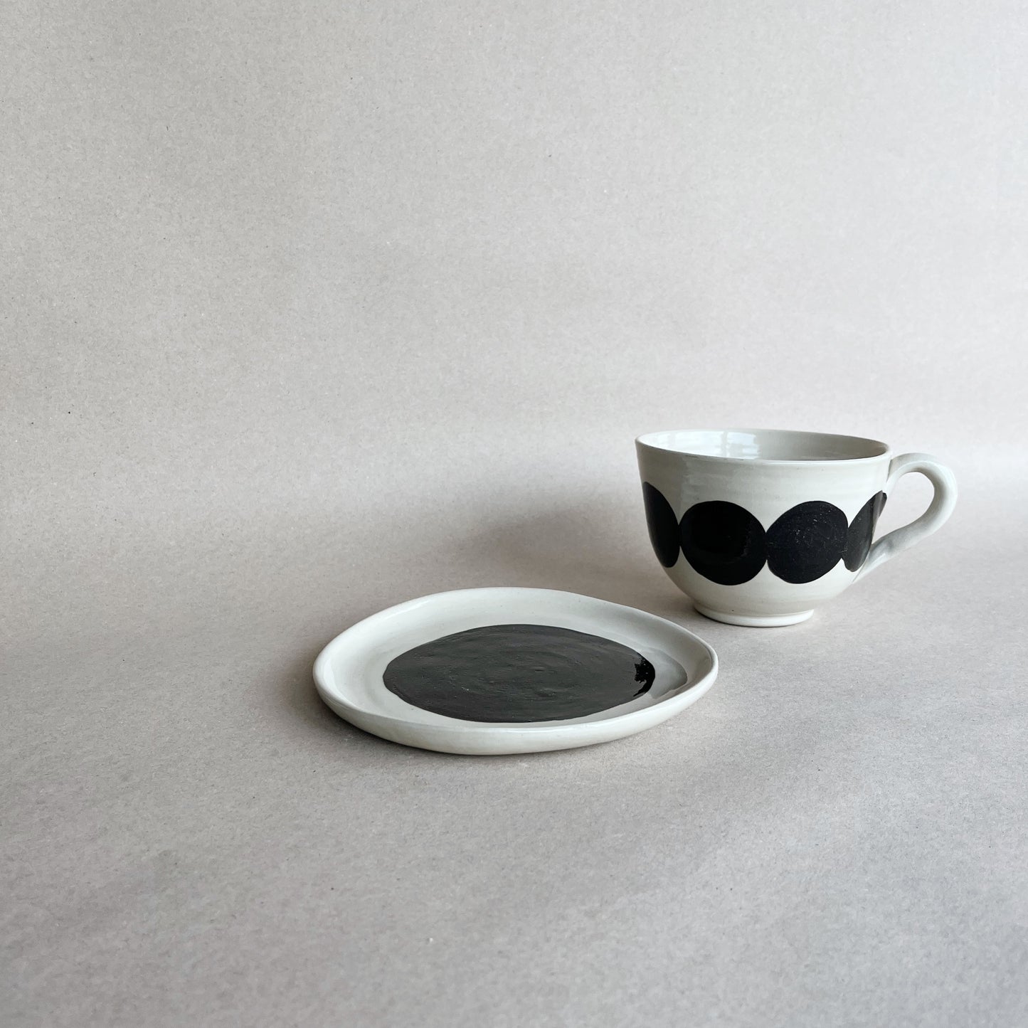 handmade ceramic lluna large cup on the side of lluna dessert plate